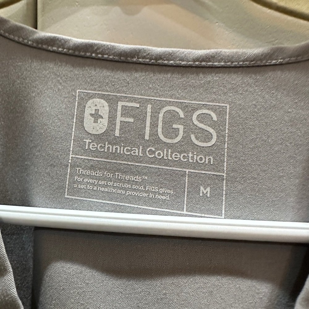 Figs grey medium top and bottom. SMALL BLEACH SPOT ON PANTS.